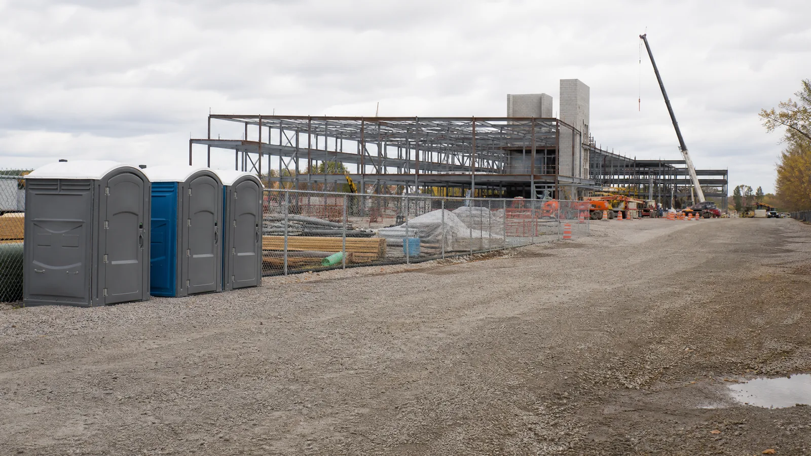 Temporary restrooms supporting a long-term commercial construction project.
